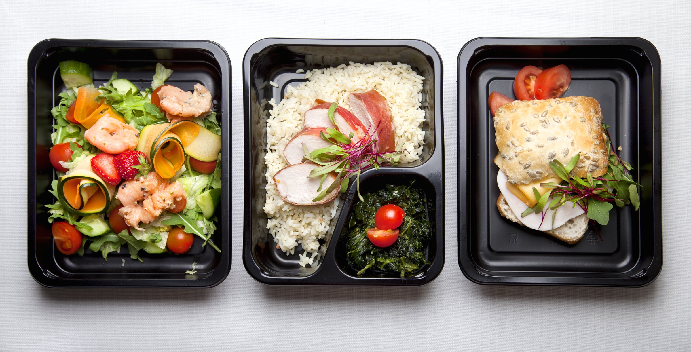 Premium takeaway food served in black containers