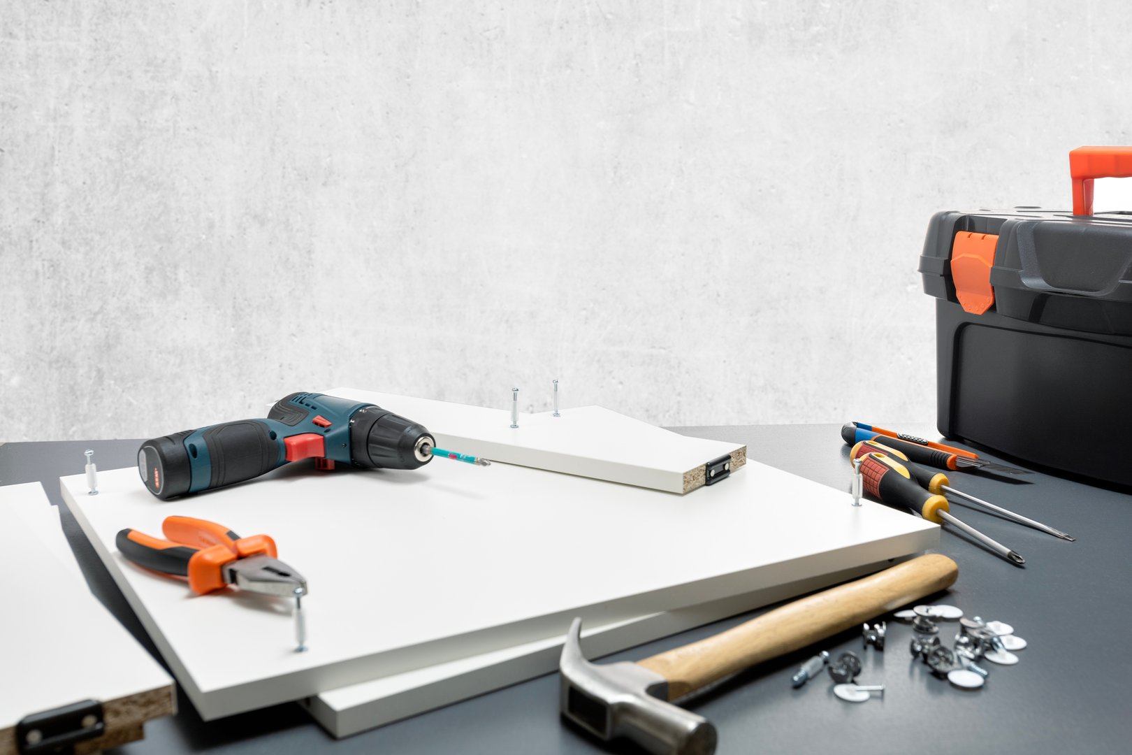 tools and furniture parts for furniture assembly  on the table.