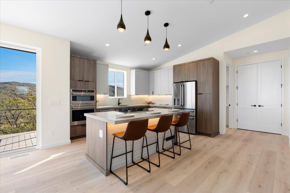 Modern kitchen with white cabinets and marble countertops