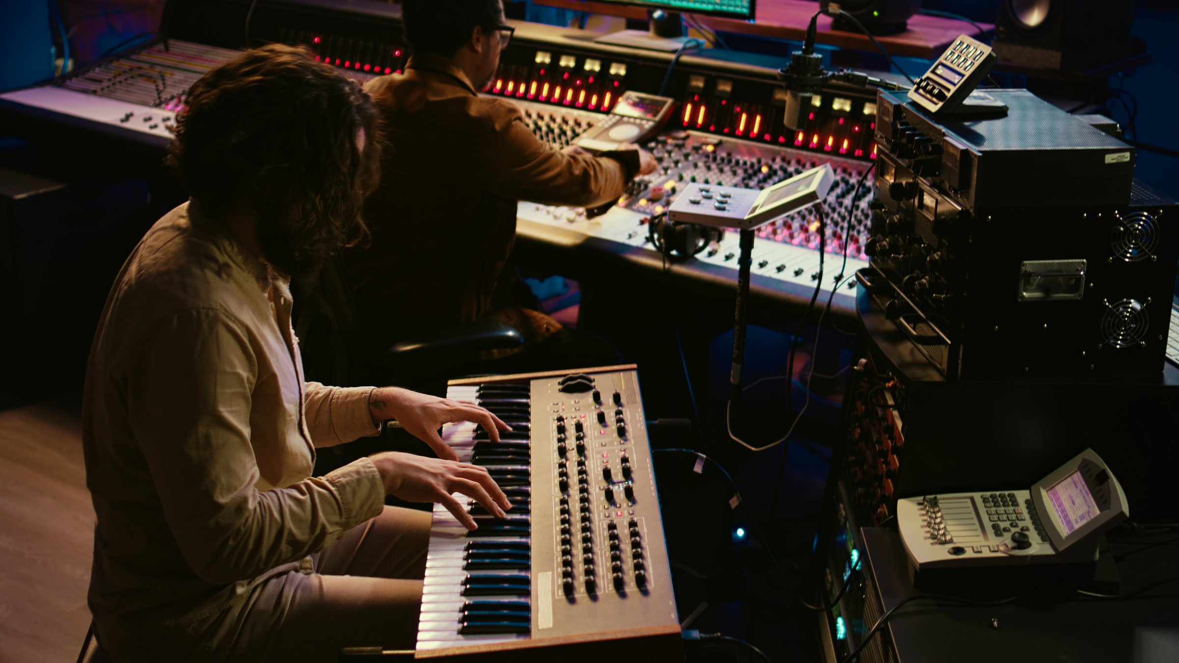 Skilled artist singer recording songs on electronic midi controller