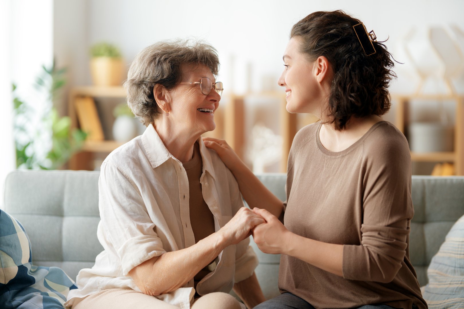Happy patient and caregiver spending time together. Senior woman and her adult daughter.