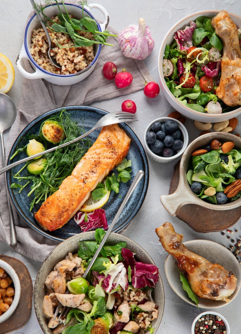 Healthy food assortment on light background. Dieting concept. Flat lay, top view, copy space