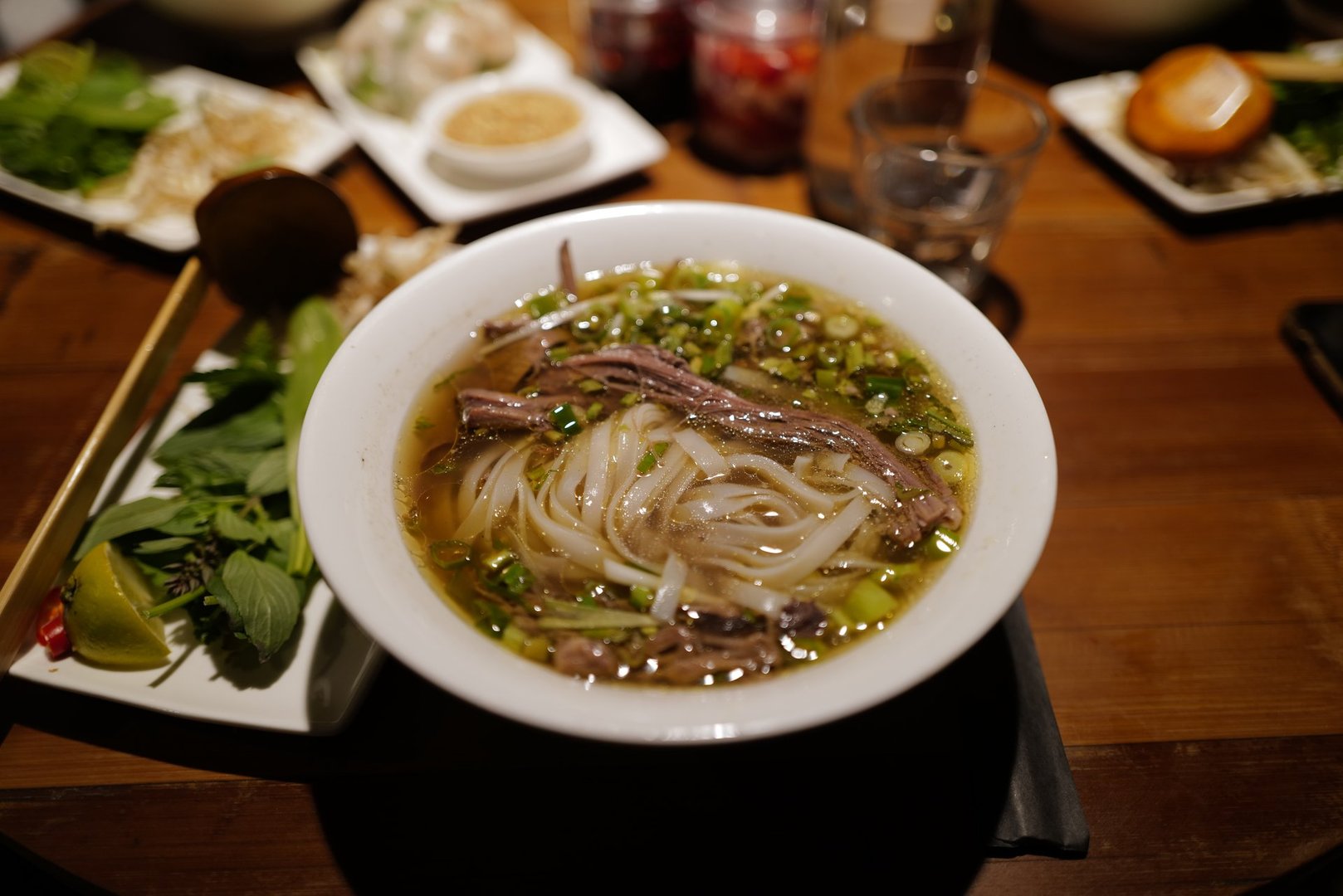 Vietnamese beef noodles soup with vegetables and organs