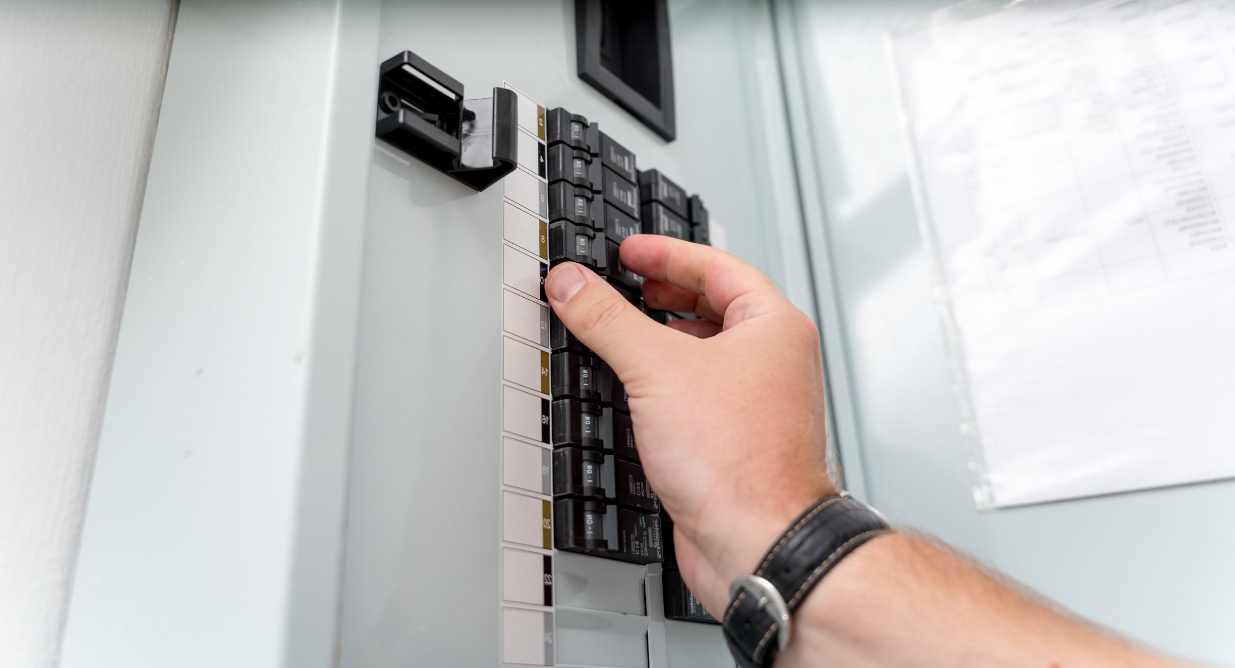 A technician works with a demo kit of the smart home system.