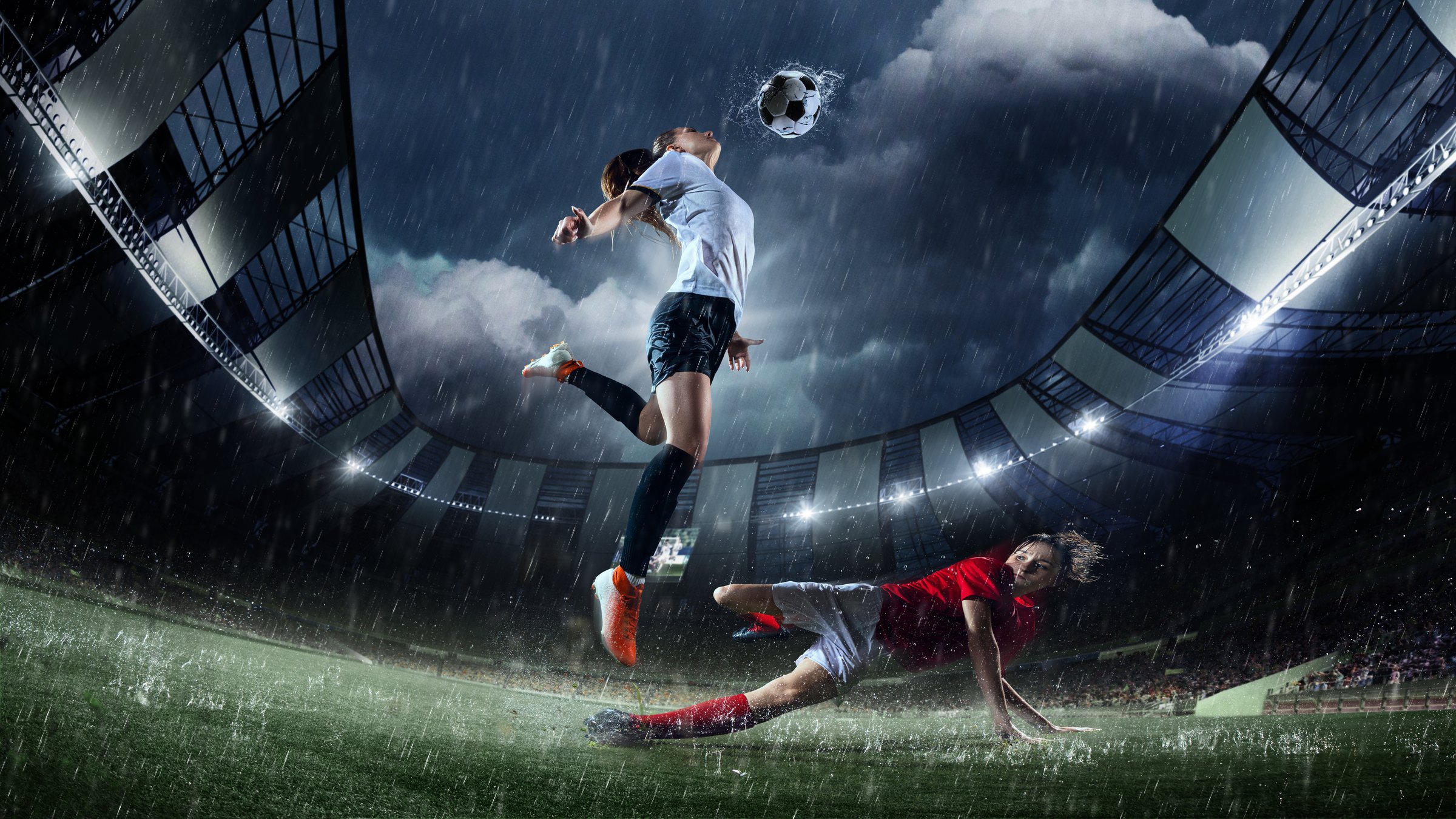 Female soccer player jumping gracefully to strike ball mid-air, captured in rain-soaked 3D-modeled stadium during competitive soccer match. Concept of professional sport, competition, tournament, game