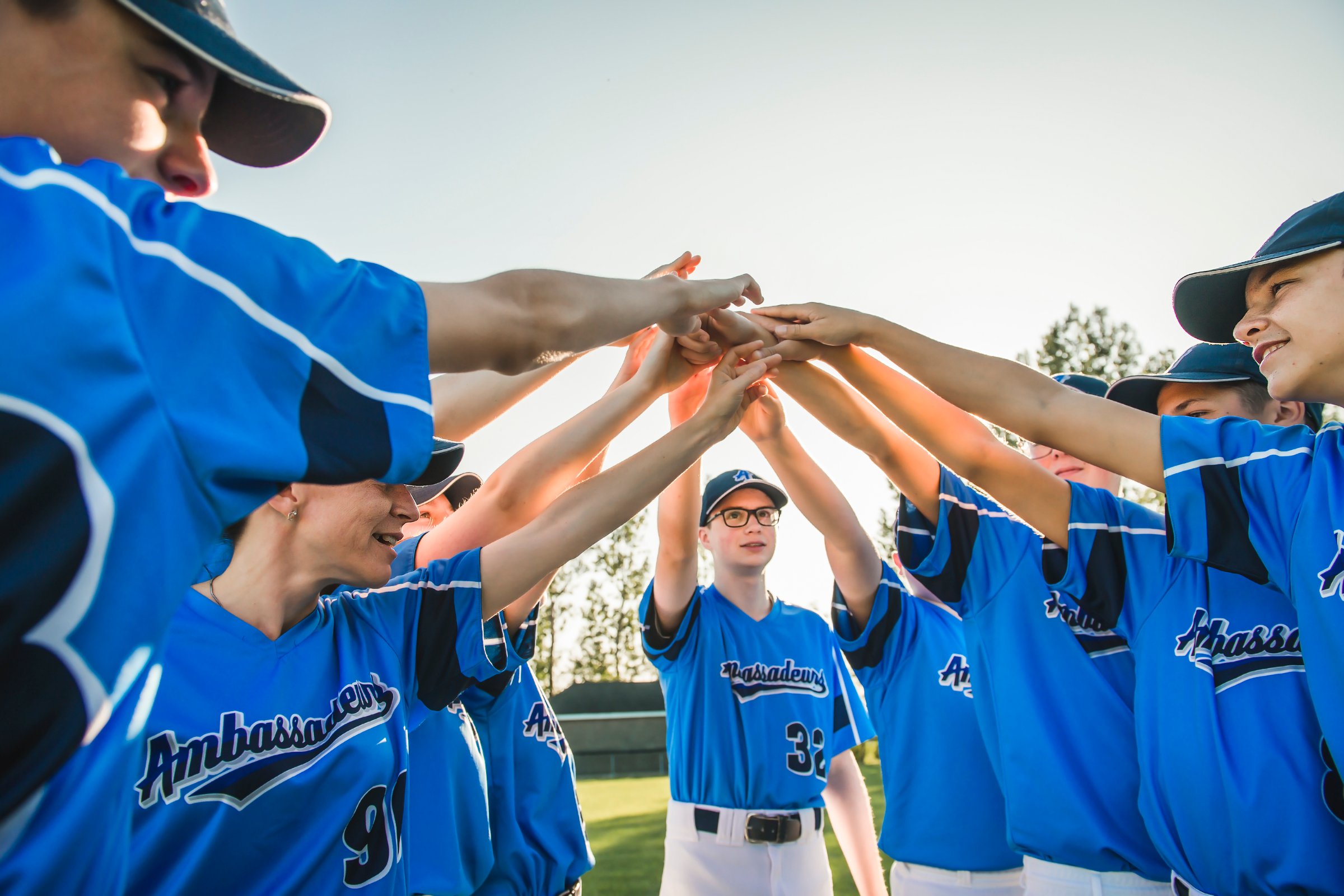 A Group of baseball players standing together on the playground
