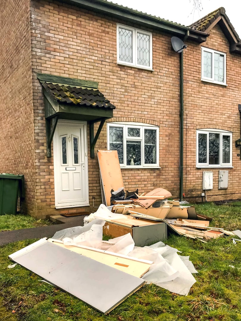 Cardiff, Wales - March 2018: Old kitchen units and other material dumped in front of a house after being removed to intstall a new kitchen.