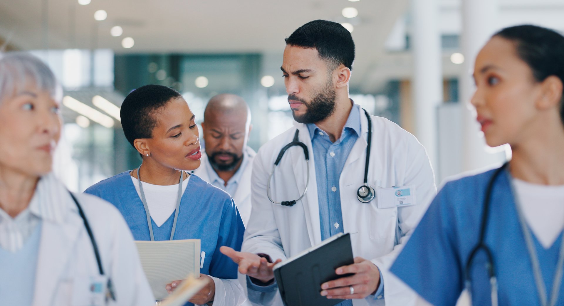 Meeting, tablet and doctors in discussion in hospital for medical results, consulting and research.