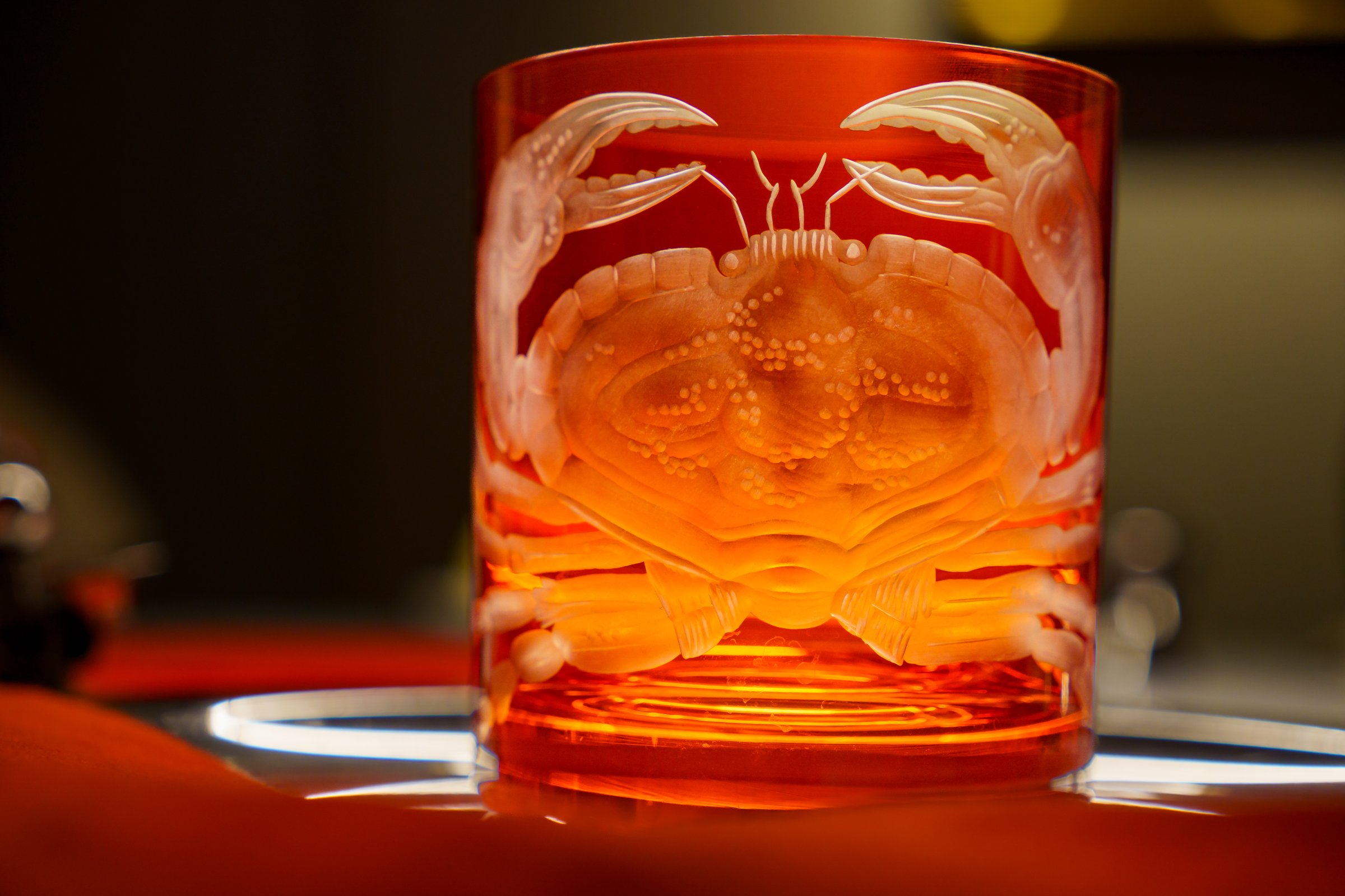 Red mouth-blown and hand-engraved crystal glass with crab motif