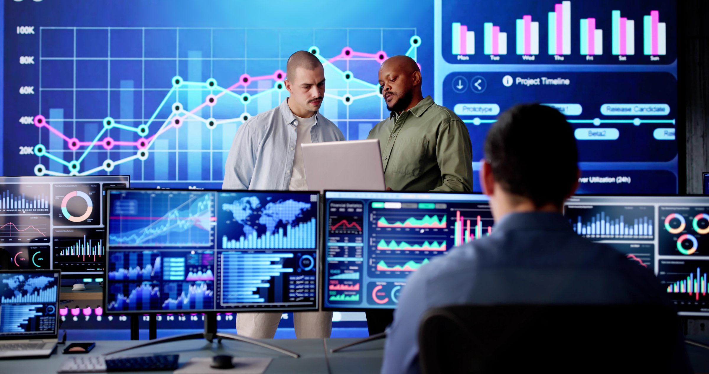 Analyzing KPI dashboard data on computer to monitor server control. The financial analyst in the data center monitoring business growth.