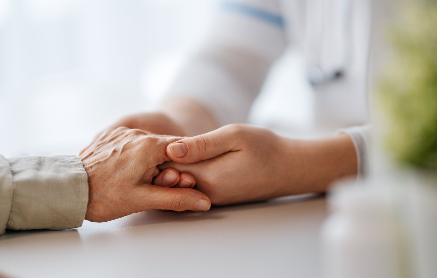 Female patient with doctor in medical office. Support of people living with tumor illness.