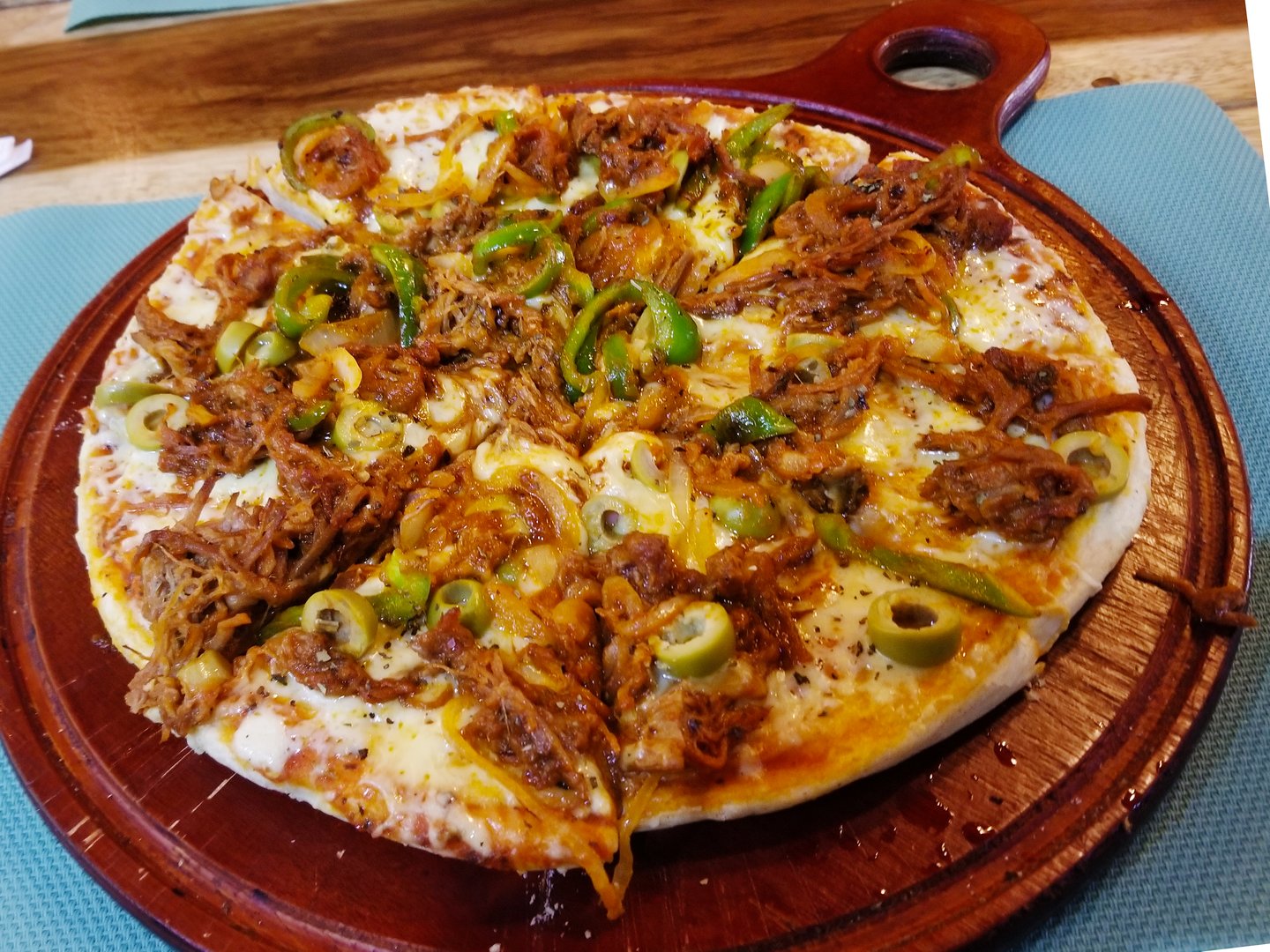 Cuban-style pizza with ham, tuna, tomatoes, and avocado