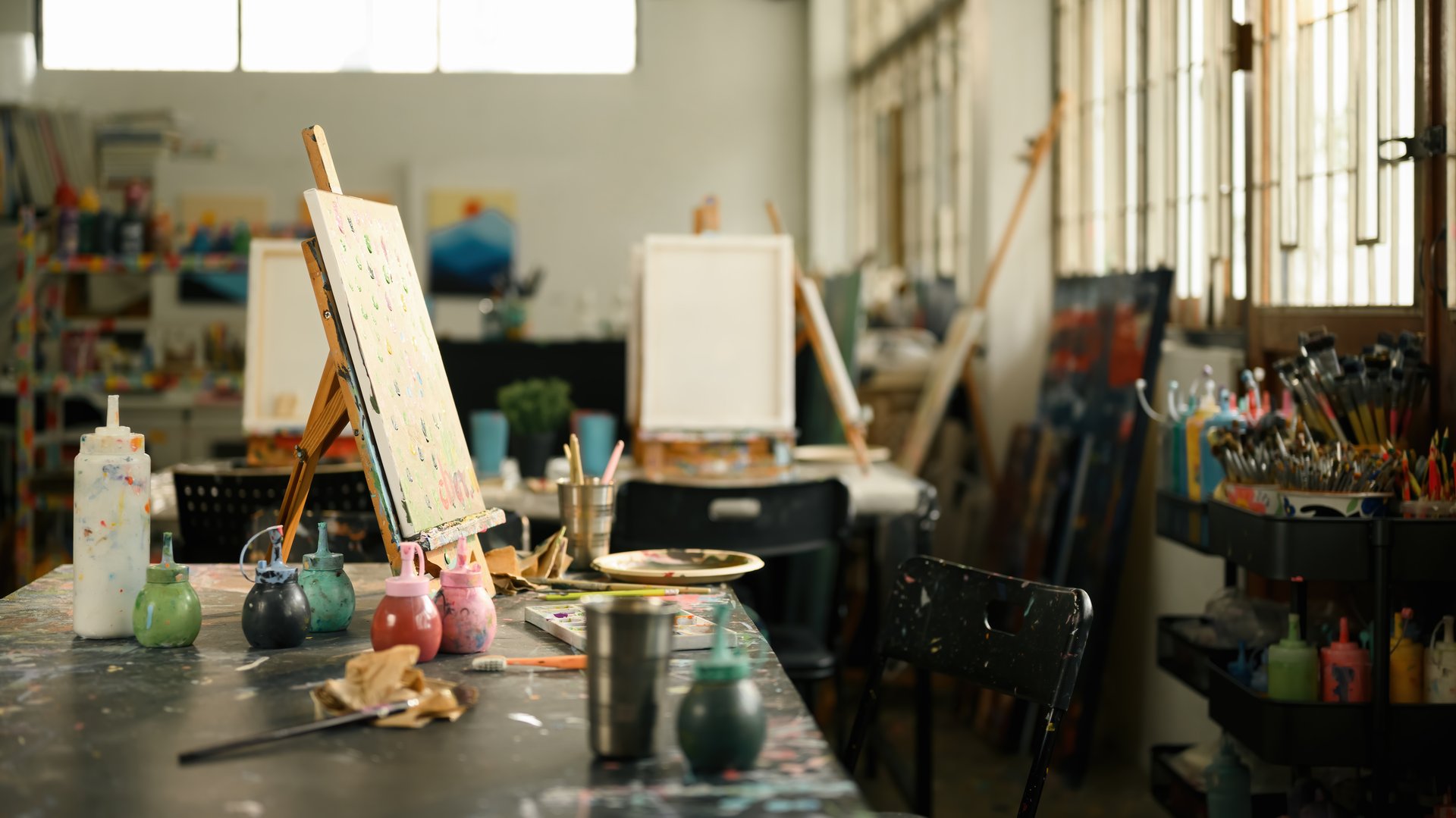 Creative Art Studio with Painting Supplies and Easels, Artistic Workspace Concept.