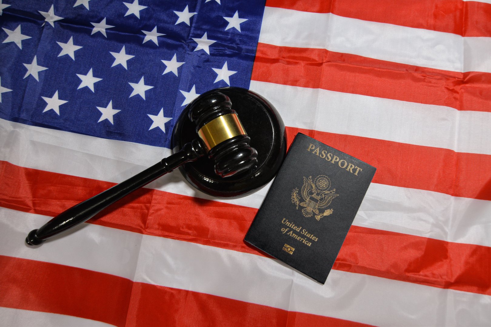 American passport with Court gavel and flag