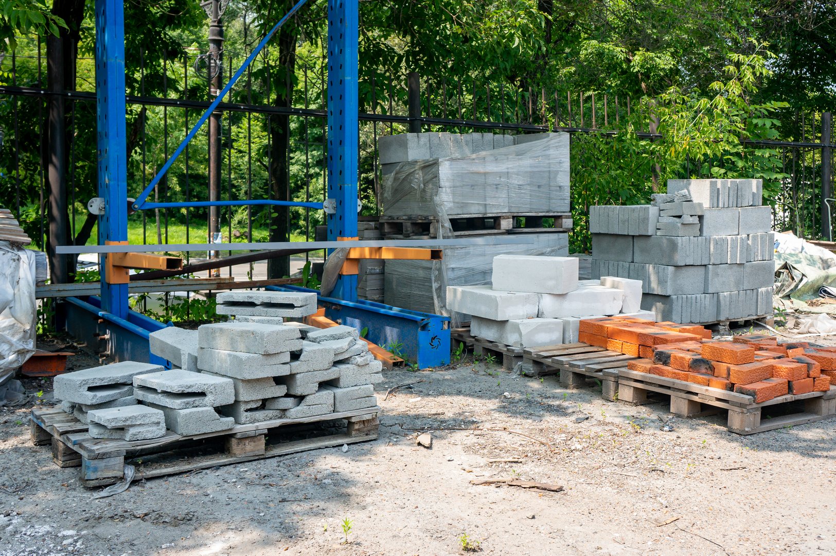 Bricks and cement blocks of various sizes are packaged and lying on the street.