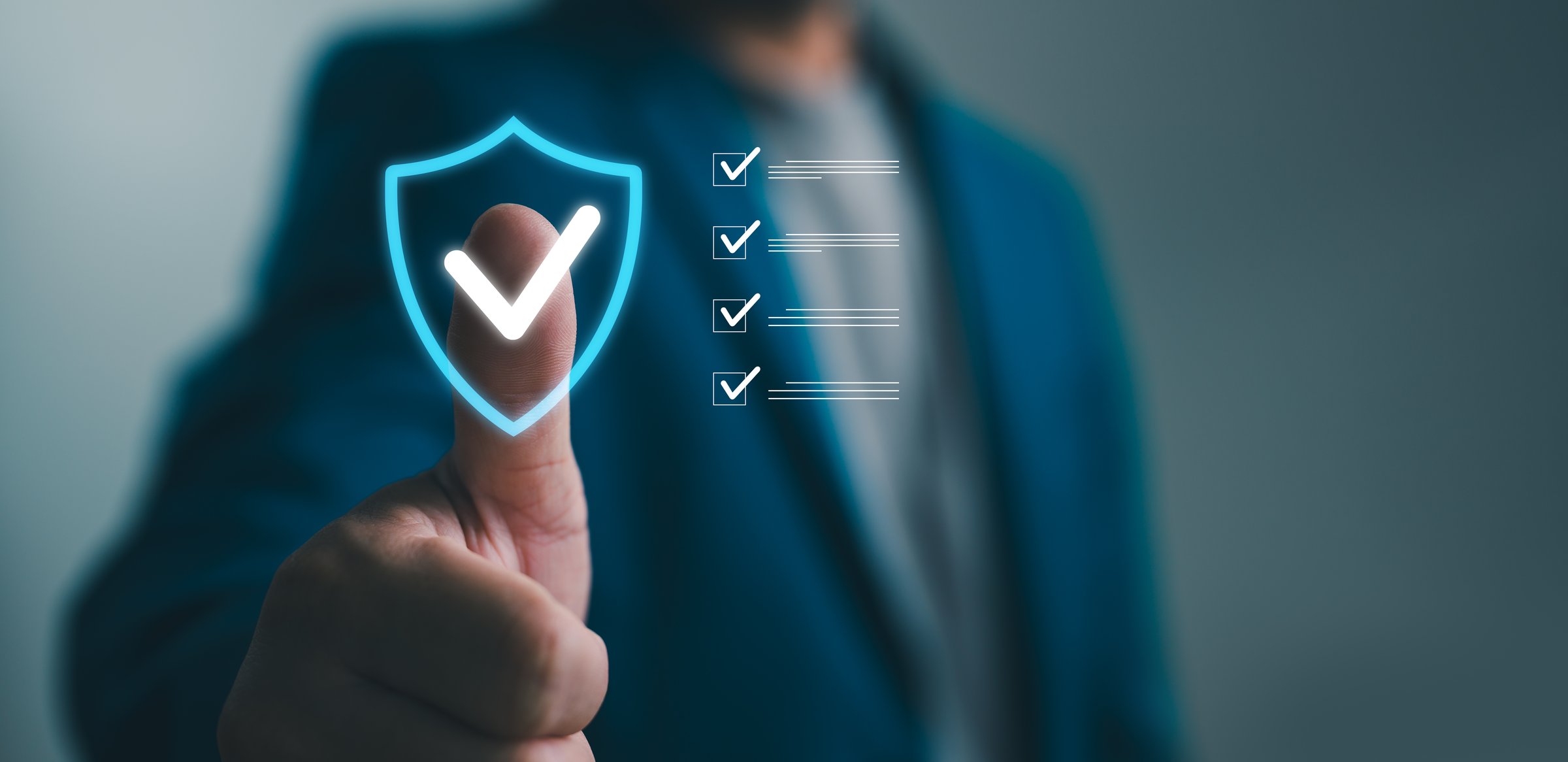 Photograph of a confident businessman giving a thumbs up with a digital security shield and checklist overlay. Use this image to demonstrate the importance of safety, security, and compliance in corporate blogs and advertisements.