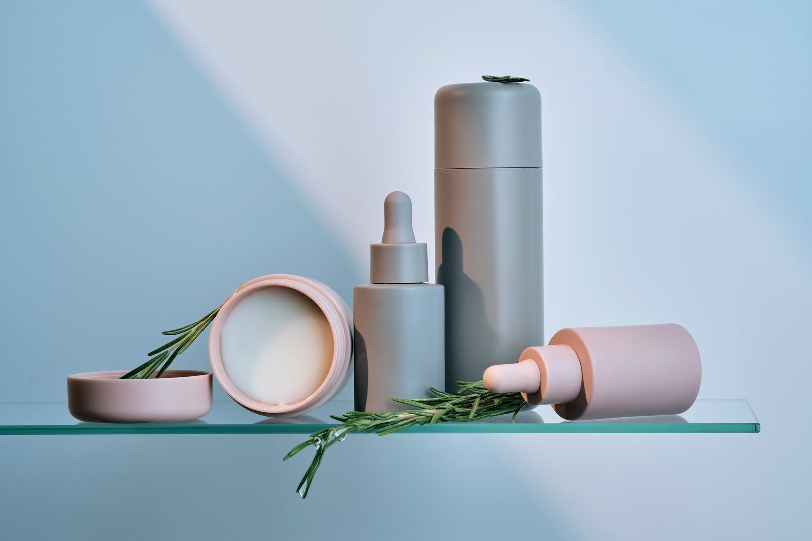 Cosmetic care products on glass shelf