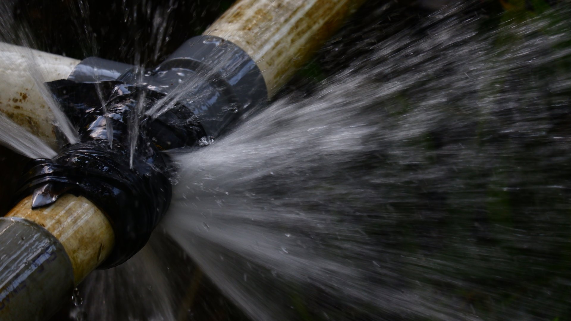 Photography of water spray coming out of a leaking pipe