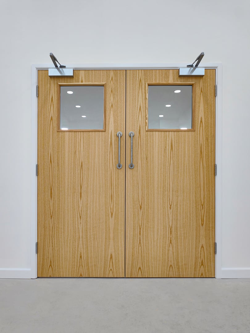 Modern double wooden fire door with closers