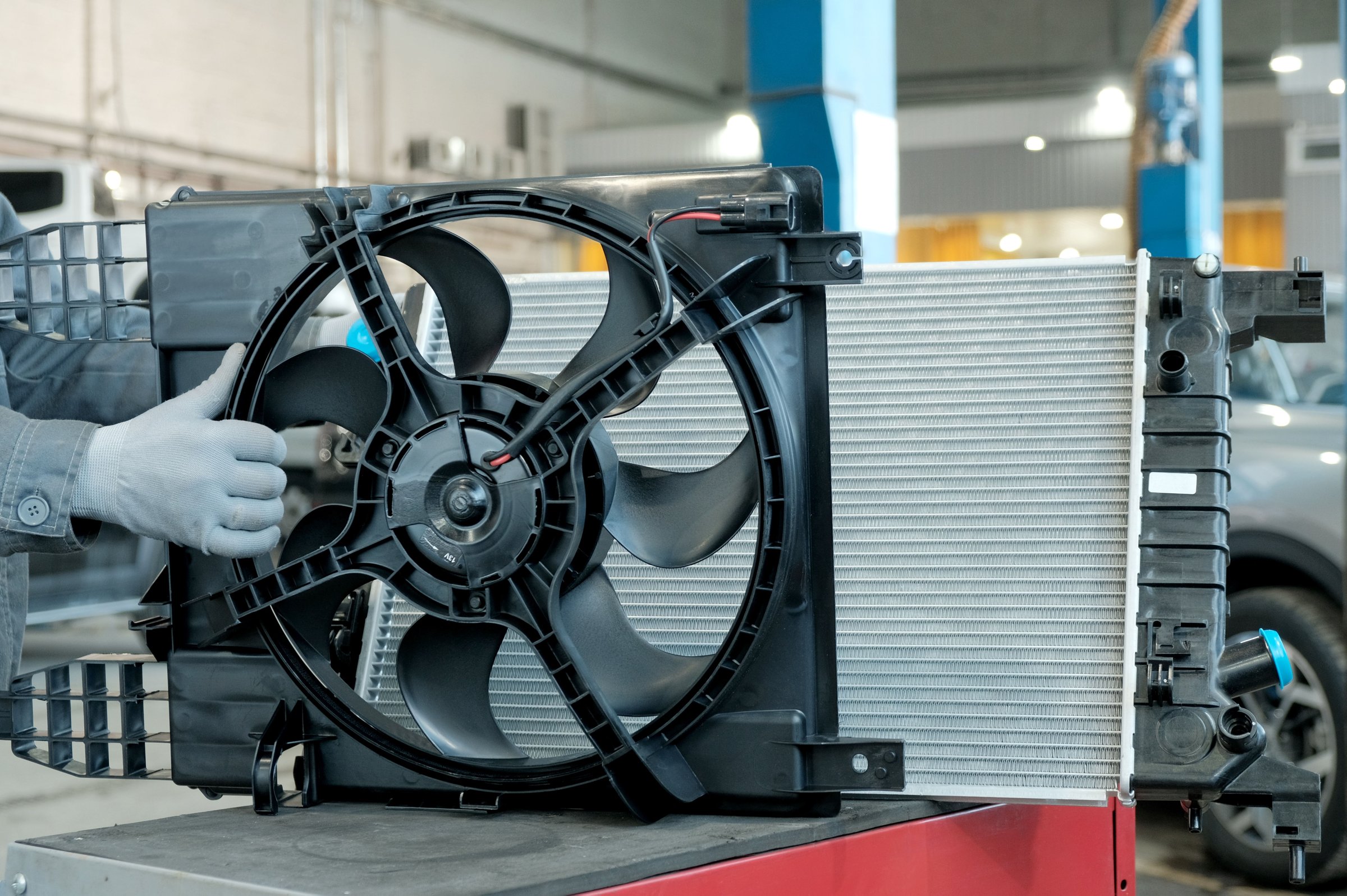 Mechanic checking car radiator