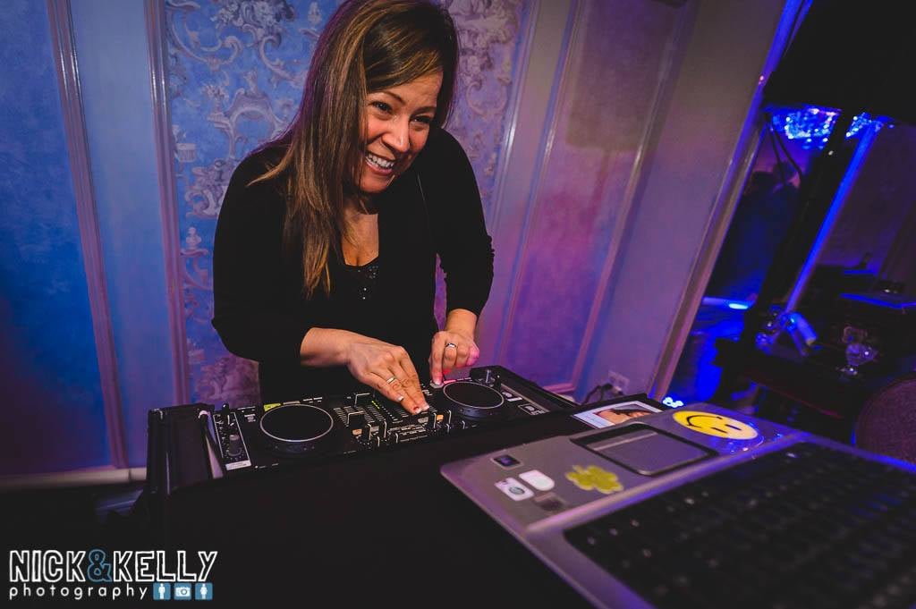 Tara Feeley mixing at the DJ board