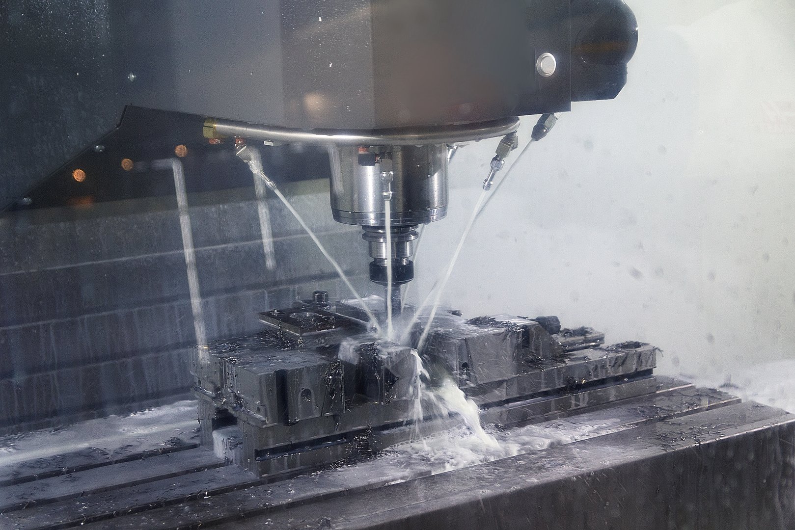 Auto CNC turning with robot drill milling factory with water coolant streams. Industry
