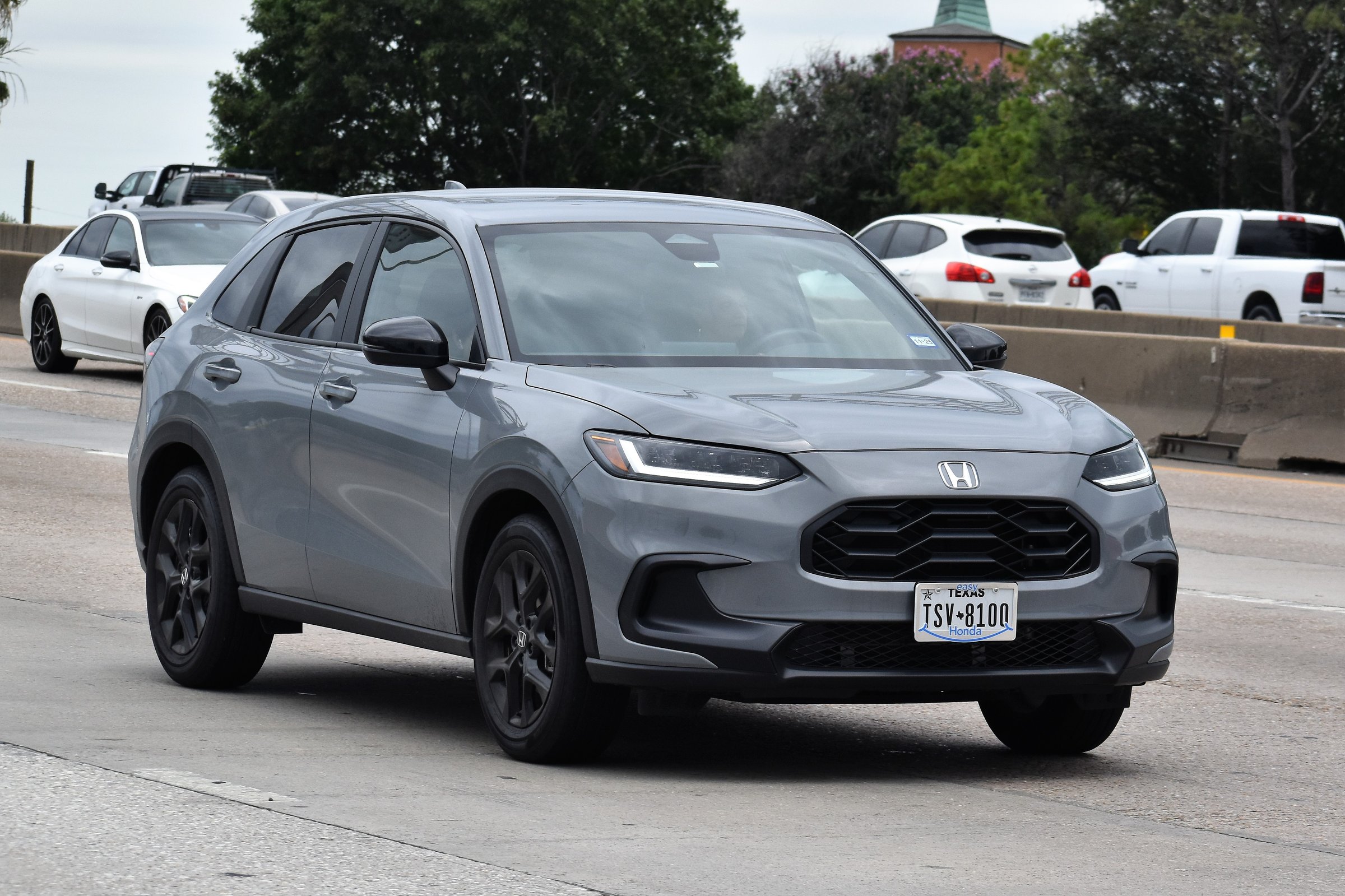 Houston, TX USA - 5/11/2024 - A portrait of a gray Honda HR-V SUV traveling down a highway in moderate traffic