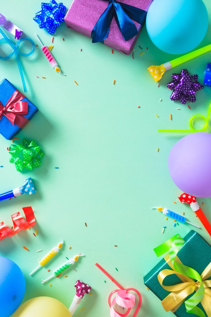 Vertical Birthday Party Frame. A festive border of colorful gifts, balloons, and party favors on a mint green background.