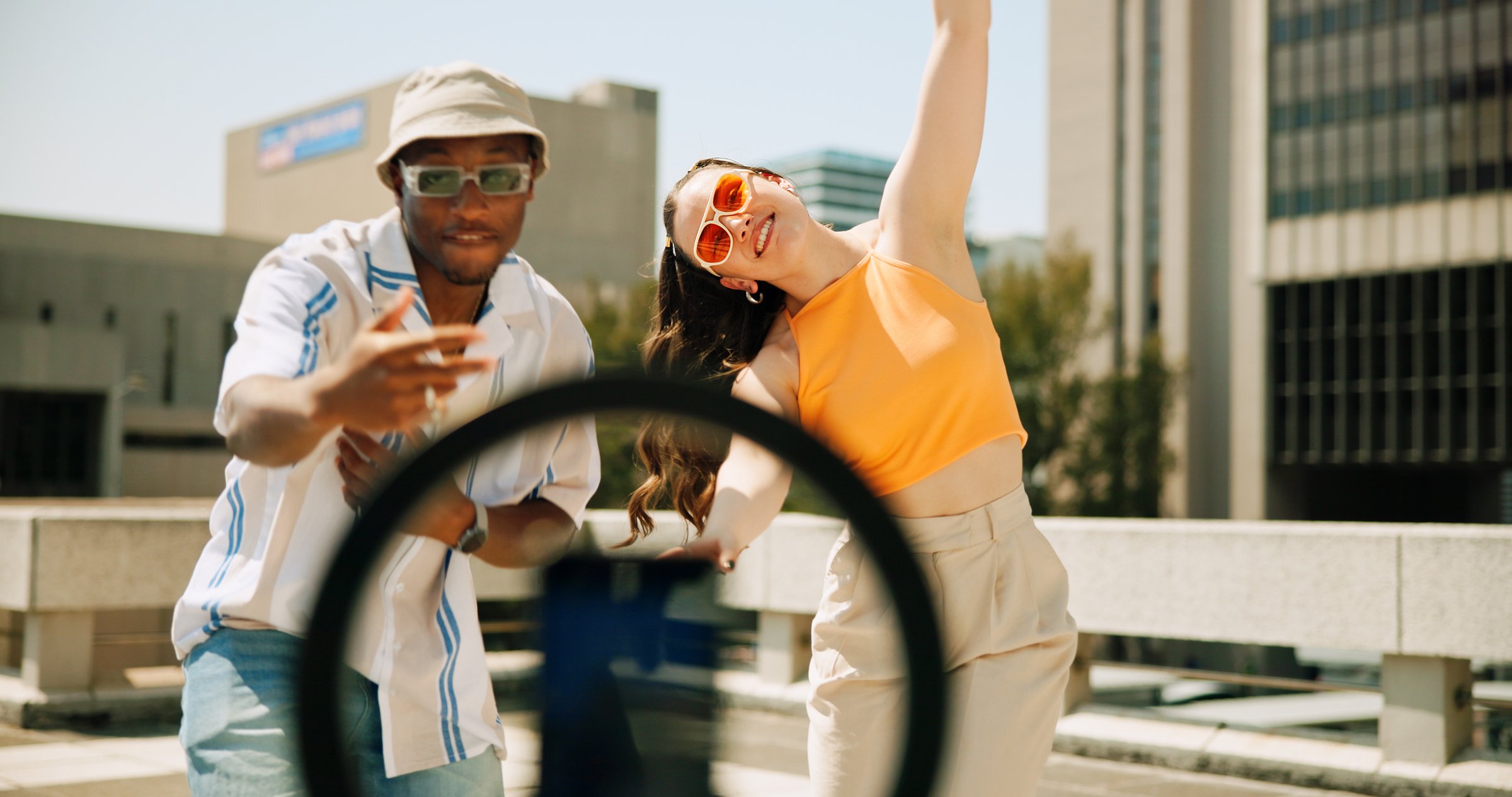 Influencer, couple and dancing on vlog, online and fun with talent, live streaming and entertainment. Energy, active and content creation for dancer, people and challenge for social media and roof