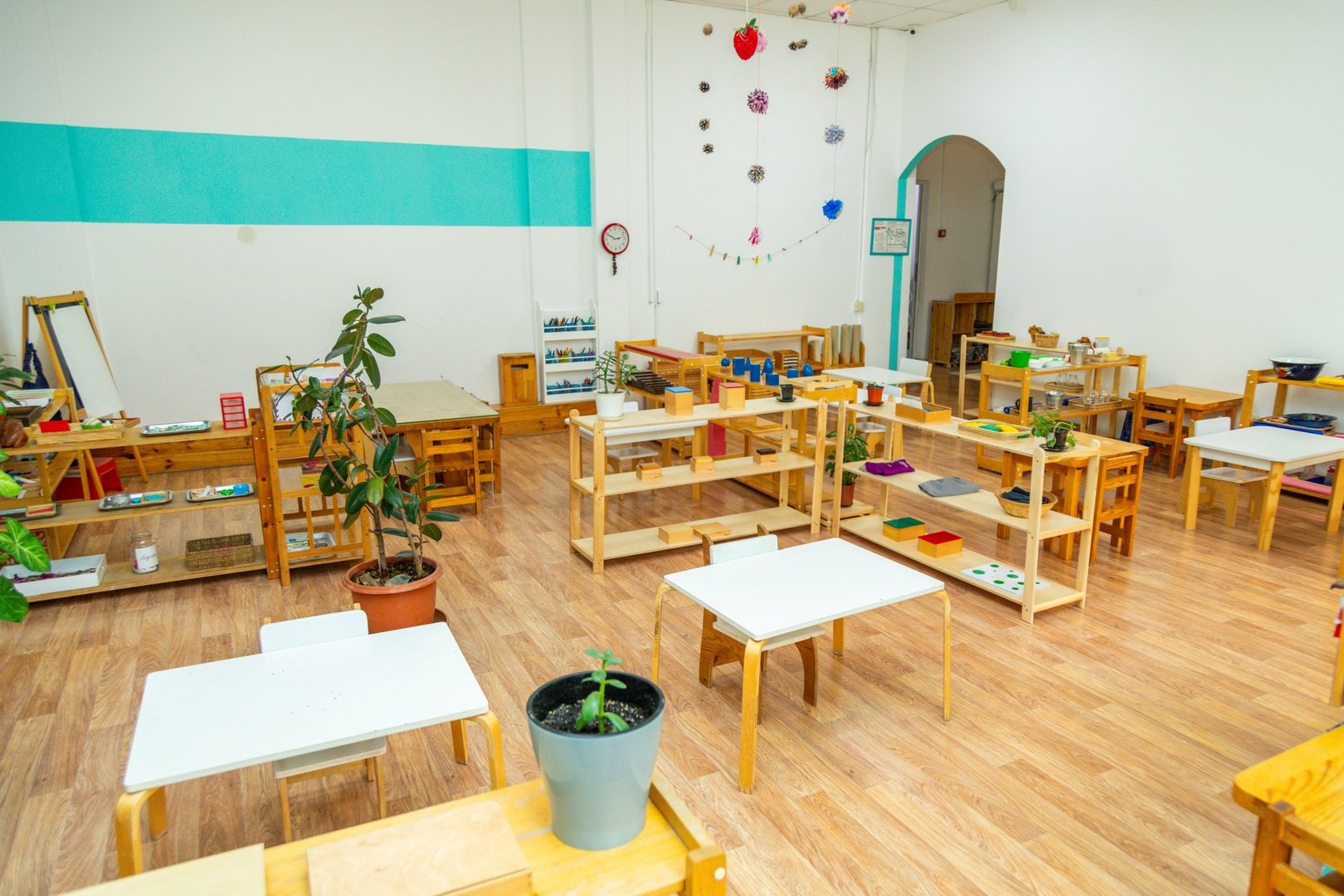 A Montessori kindergarten classroom featuring various educational materials and furniture