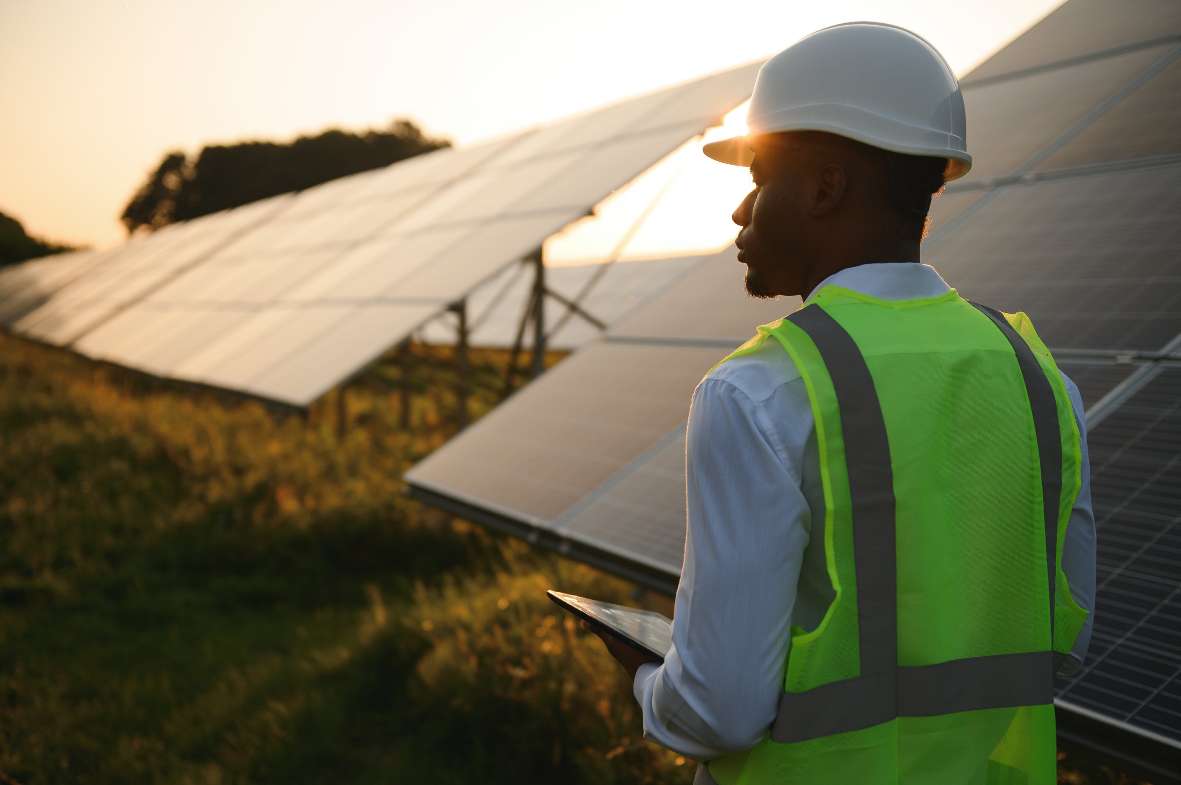 African american technician check the maintenance of the solar panels. Black man engineer at solar station