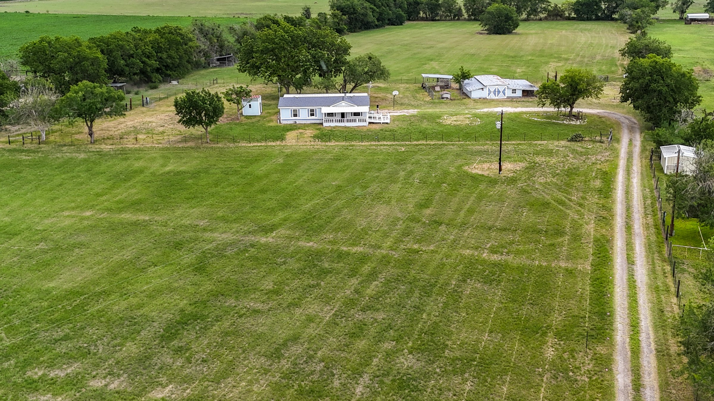 New Braunfels real estate - aerial view of residential property for sale with home and acreage