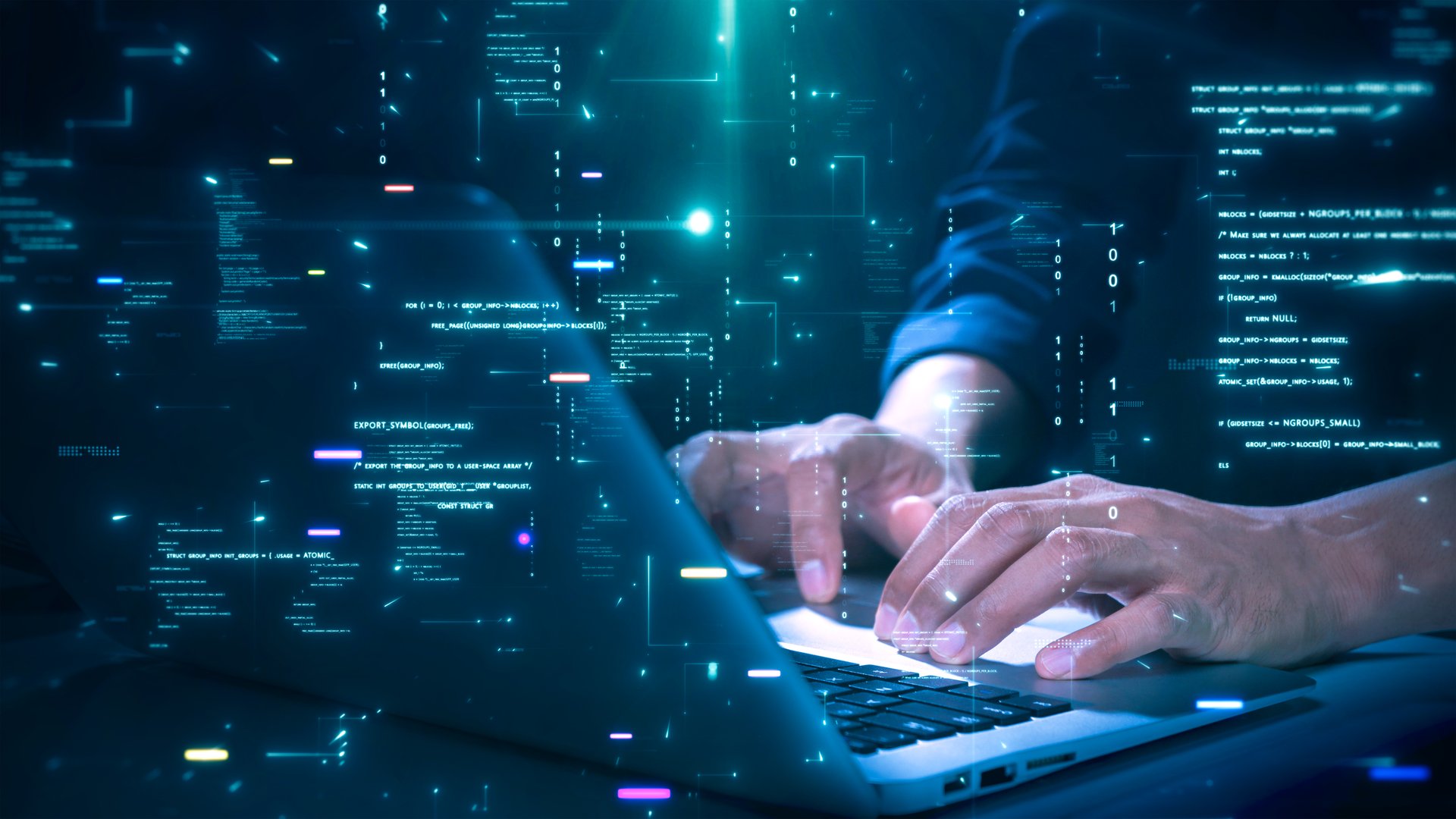 IT professional writing code and reviewing cybersecurity systems on screen