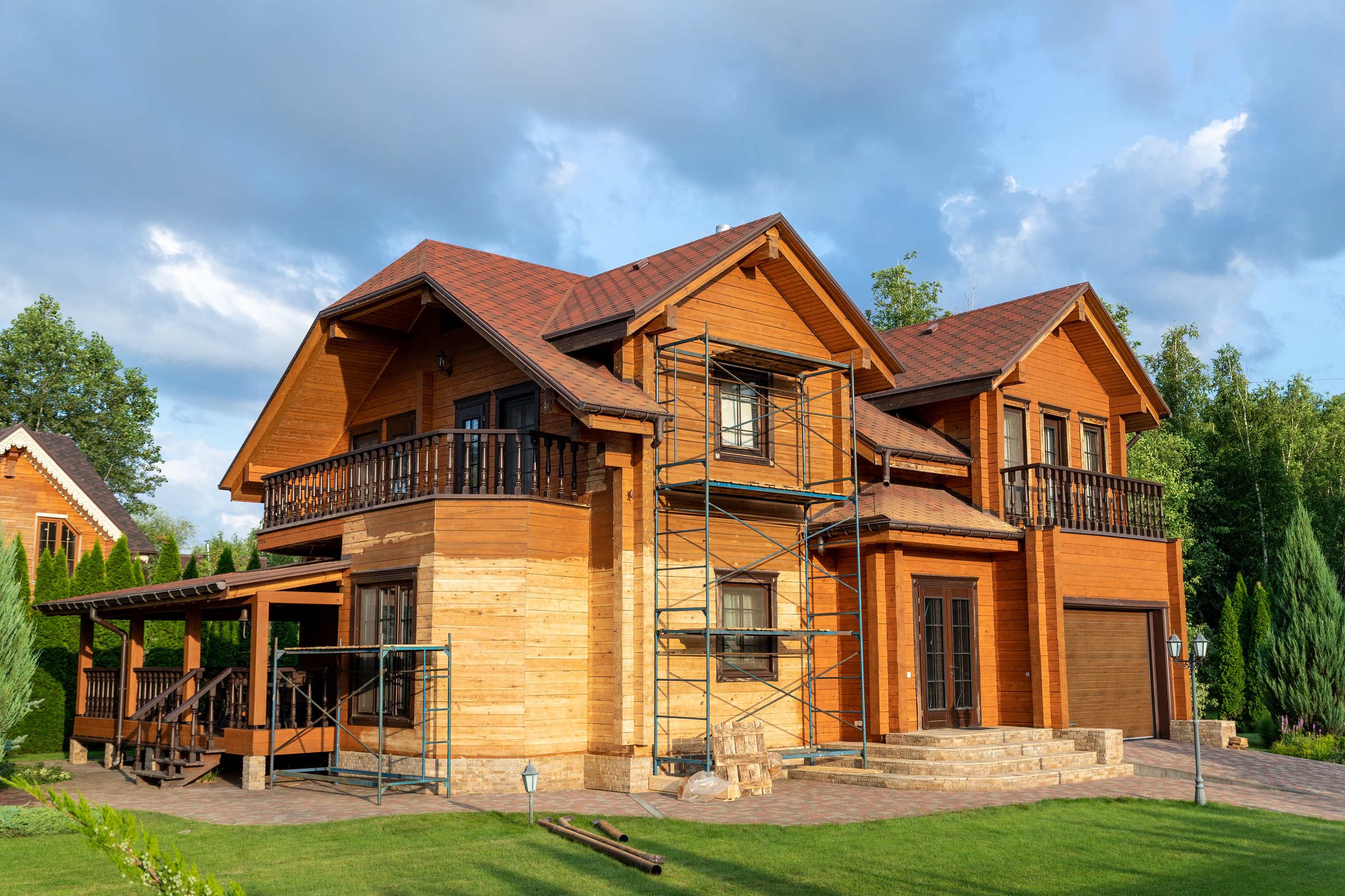 Modern wooden timber eco house villa facade during process of renovation