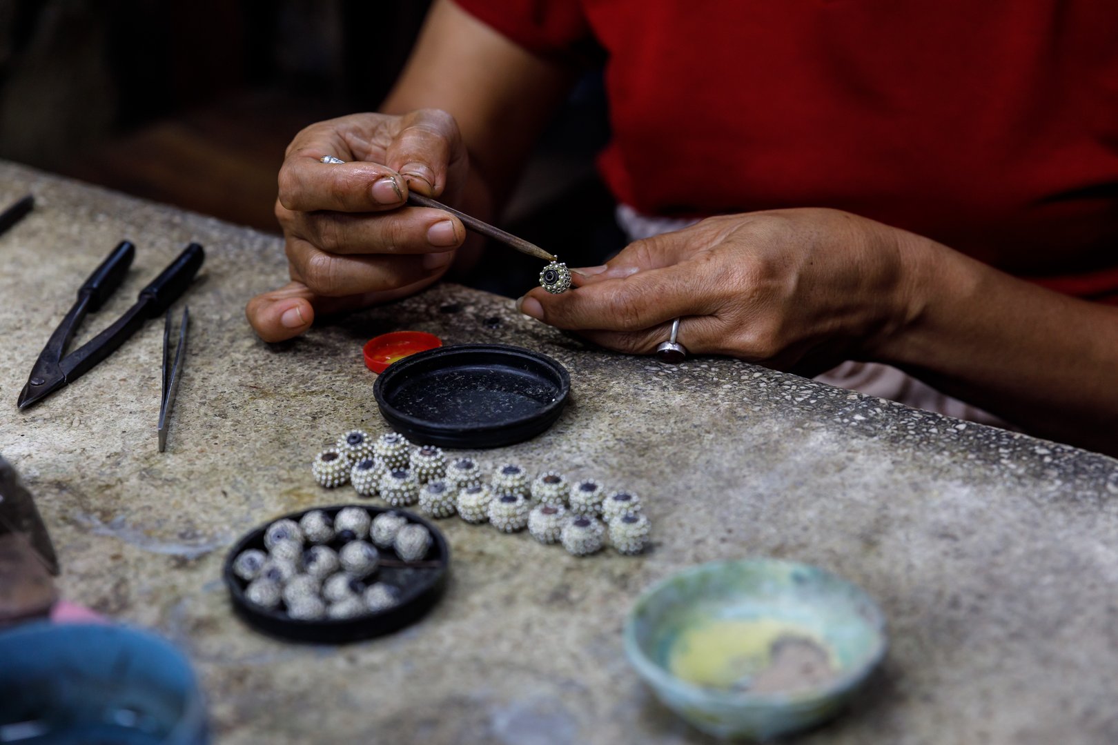 Person making silver jewelry