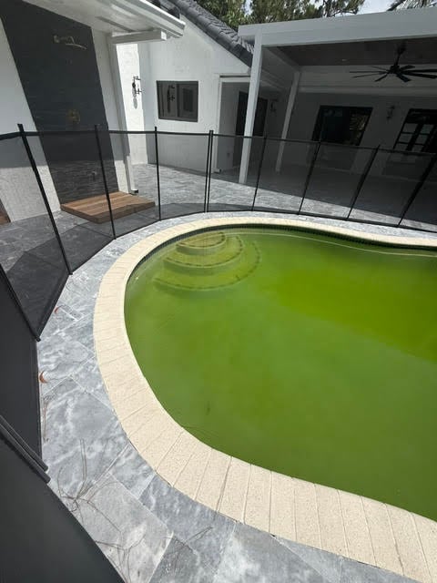 Before image of a pool with stains requiring cleaning