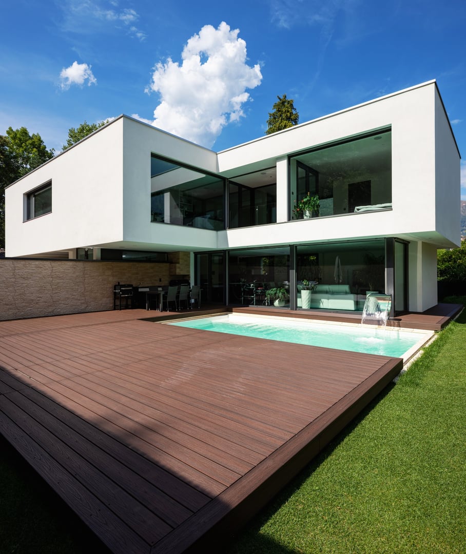 Exterior modern white villa with pool and garden, nobody inside