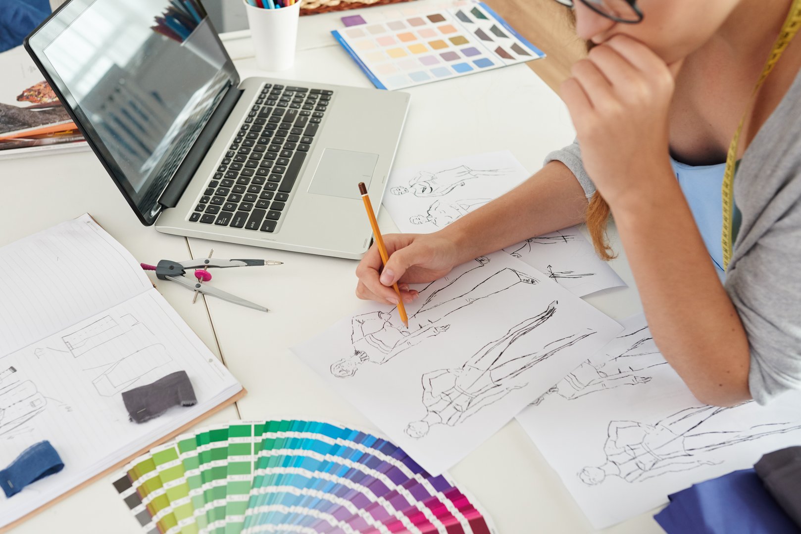 Fashion designer drawing new models for the spring collection