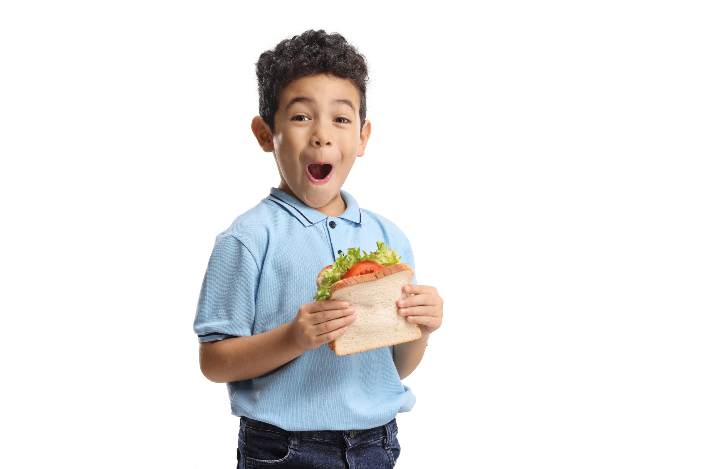 Overjoyed boy holding a sandwich isolated on white background