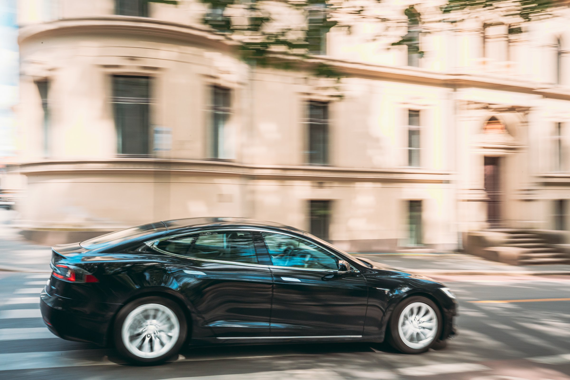 Oslo, Norway - June 24, 2019: Black Color Tesla Model S 100d Car Fast Drive In Summer City Street. The Tesla Model S Is A Full-sized All-electric Five-door, Luxury Liftback, Produced By Tesla Inc.