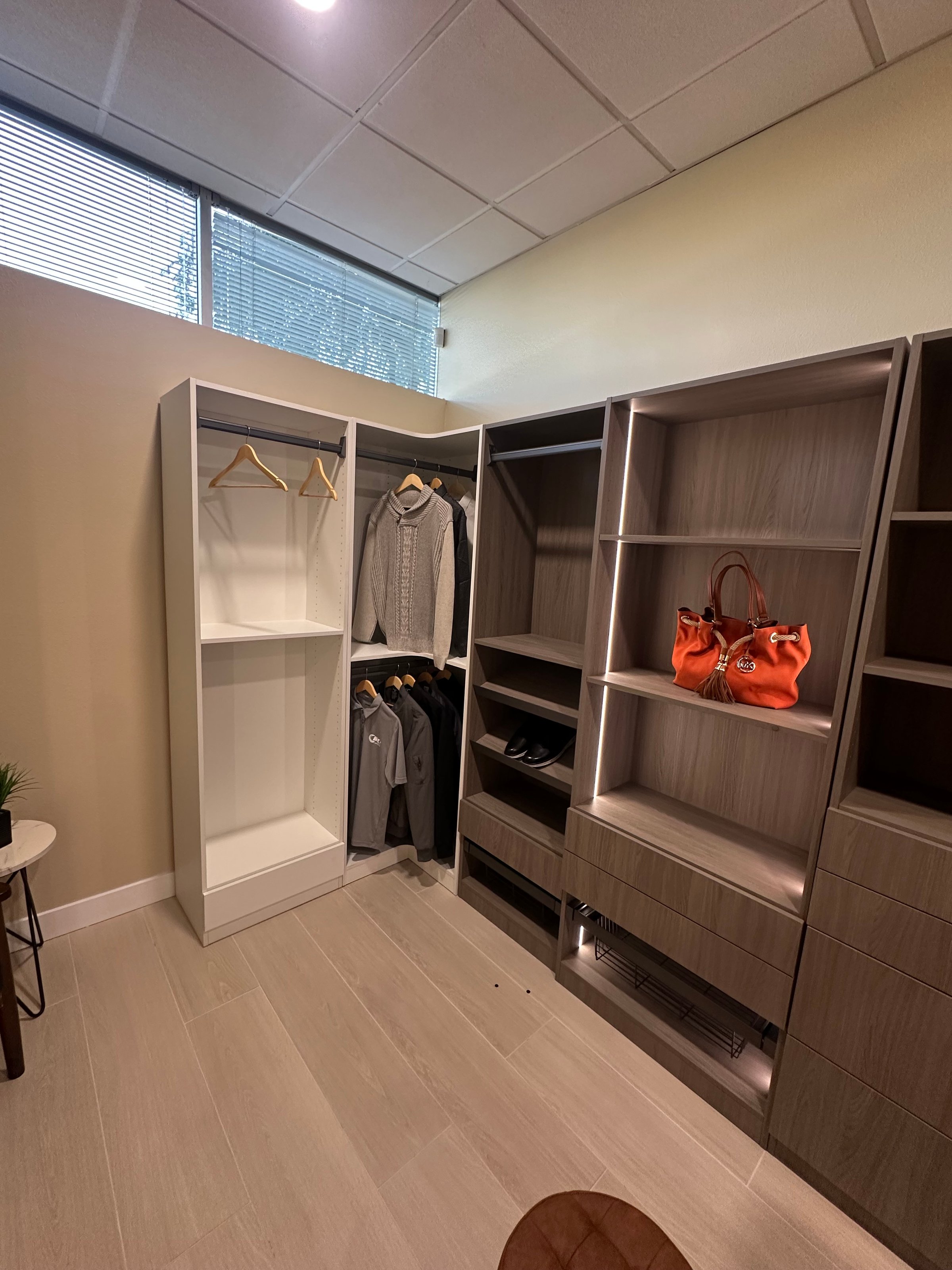 Beautiful organized walk-in closet with custom shelving and hanging space