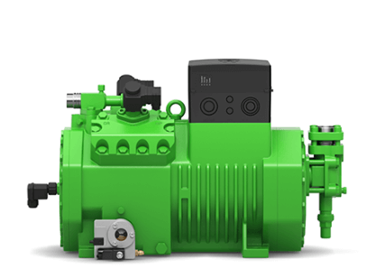 Green industrial compressor with a cylindrical body and various attachments, used in refrigeration or HVAC systems.