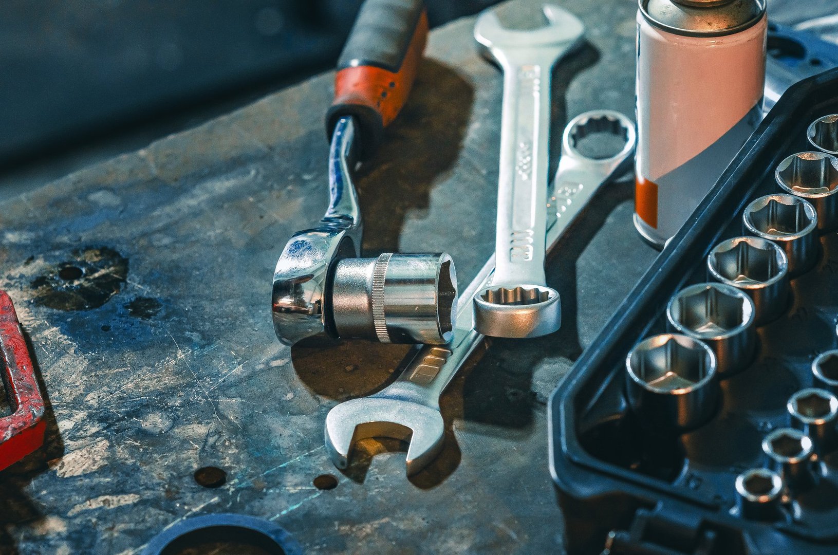 Repair mechanisms background on table with set of socket wrenches