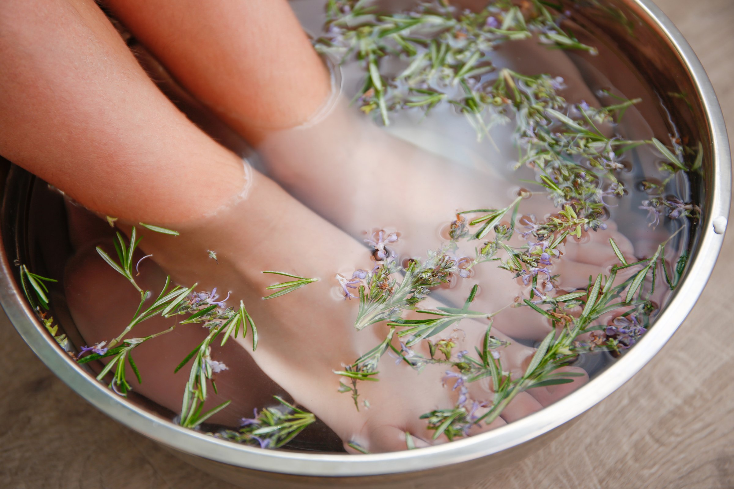 Foot baths with rosemary leaves