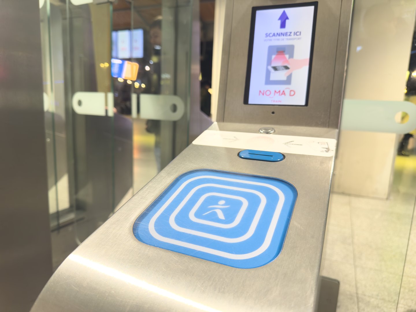 Paris,France-29.01.2025 A sleek access control panel awaits users at a bustling transit hub. Bright screens guide the way, ensuring secure entry with ease and convenience.