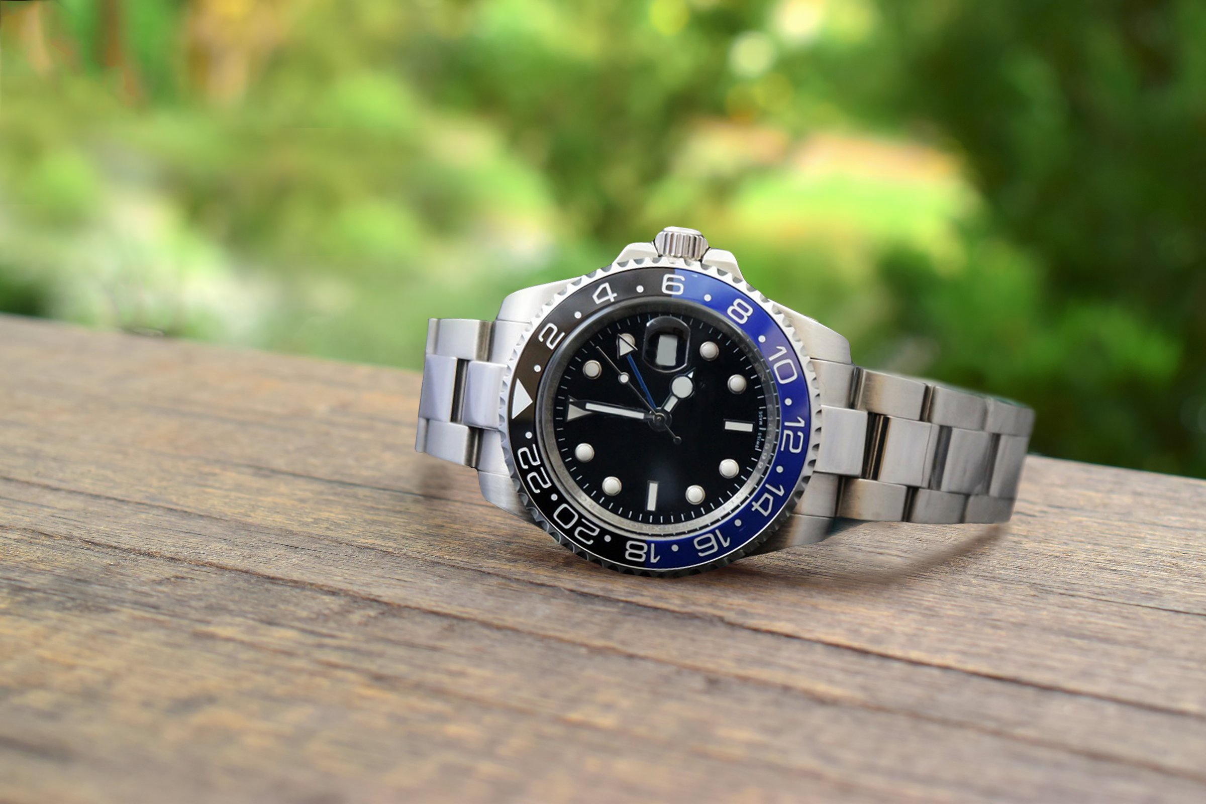 Luxury watches placed on a glittering glass floor