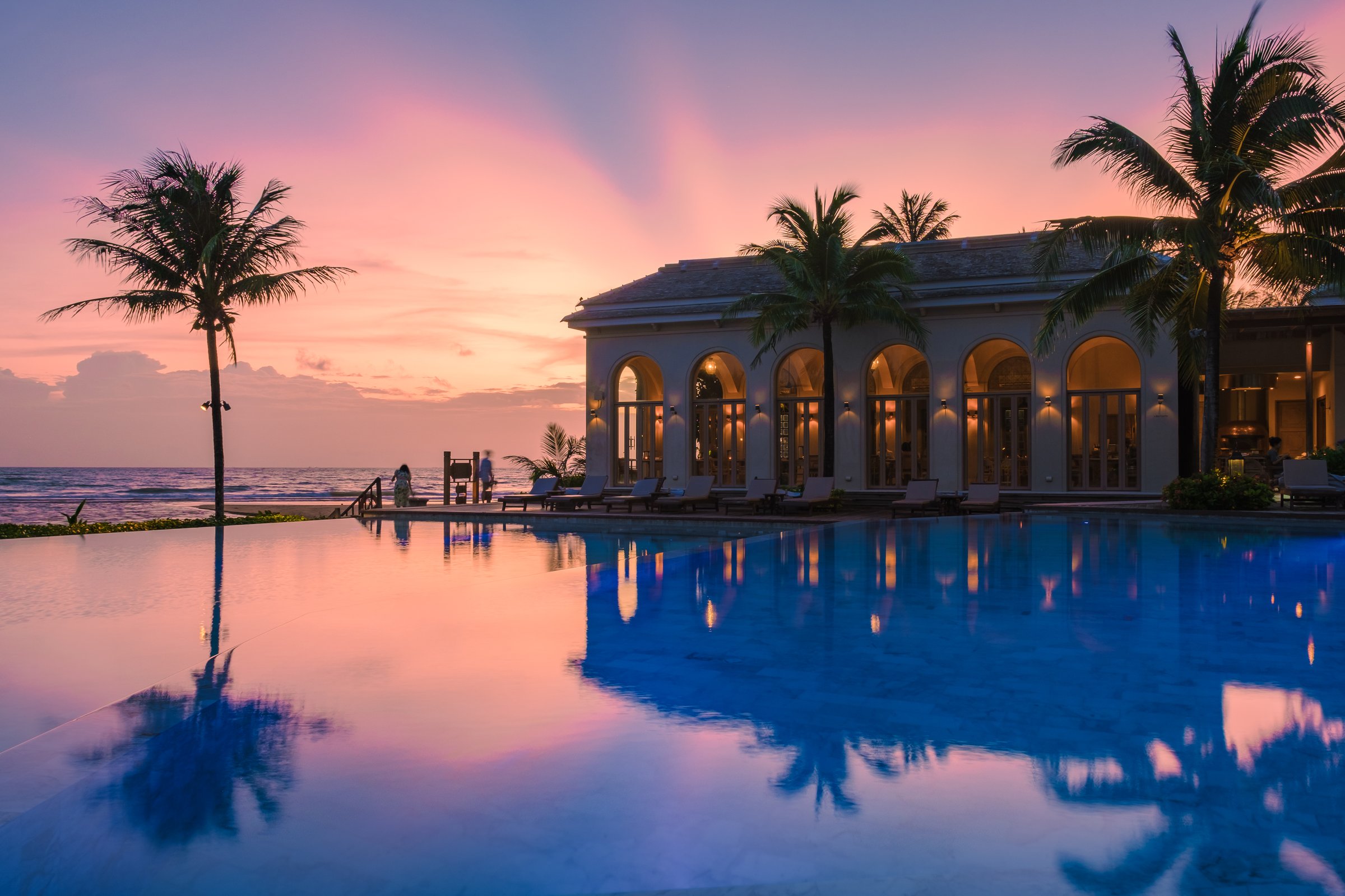 Luxurious Las Vegas resort scene with swimming pool at sunset