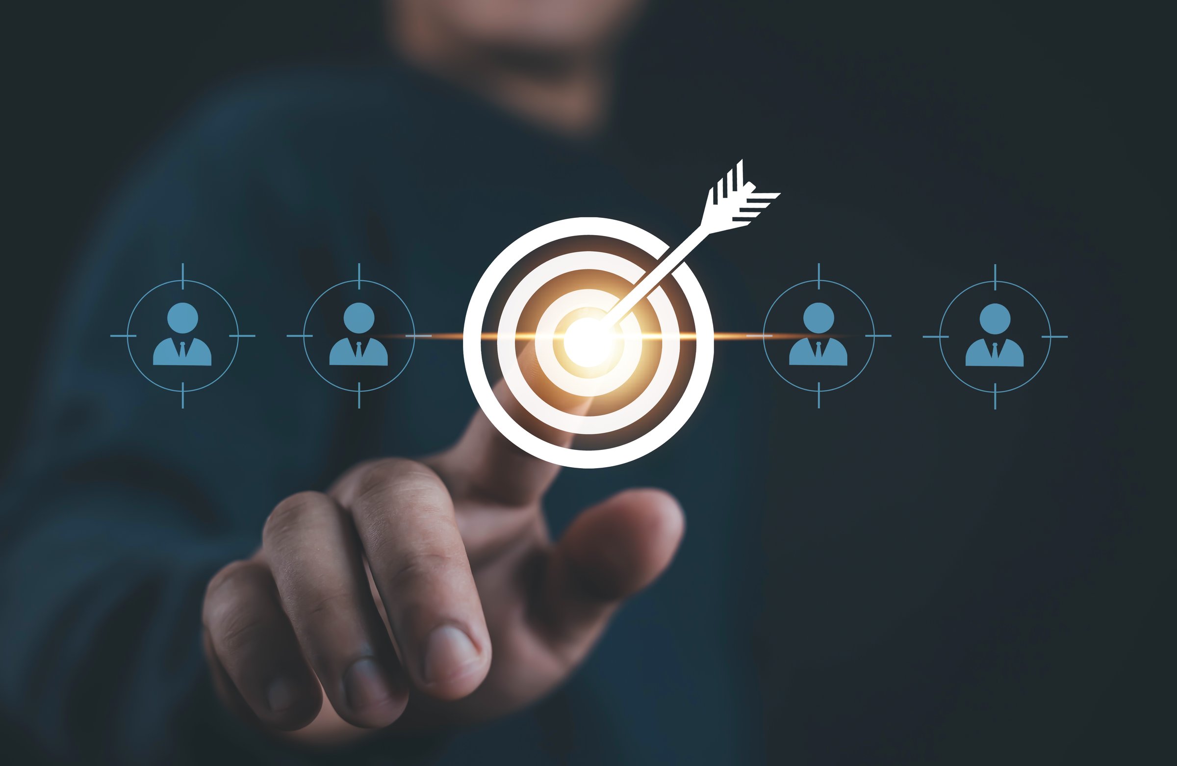 Businessman finger pointing at target with dart arrow symbol. Concept of customer targeting, business strategy, marketing success, precision advertising, sales growth, and achieving business goals.