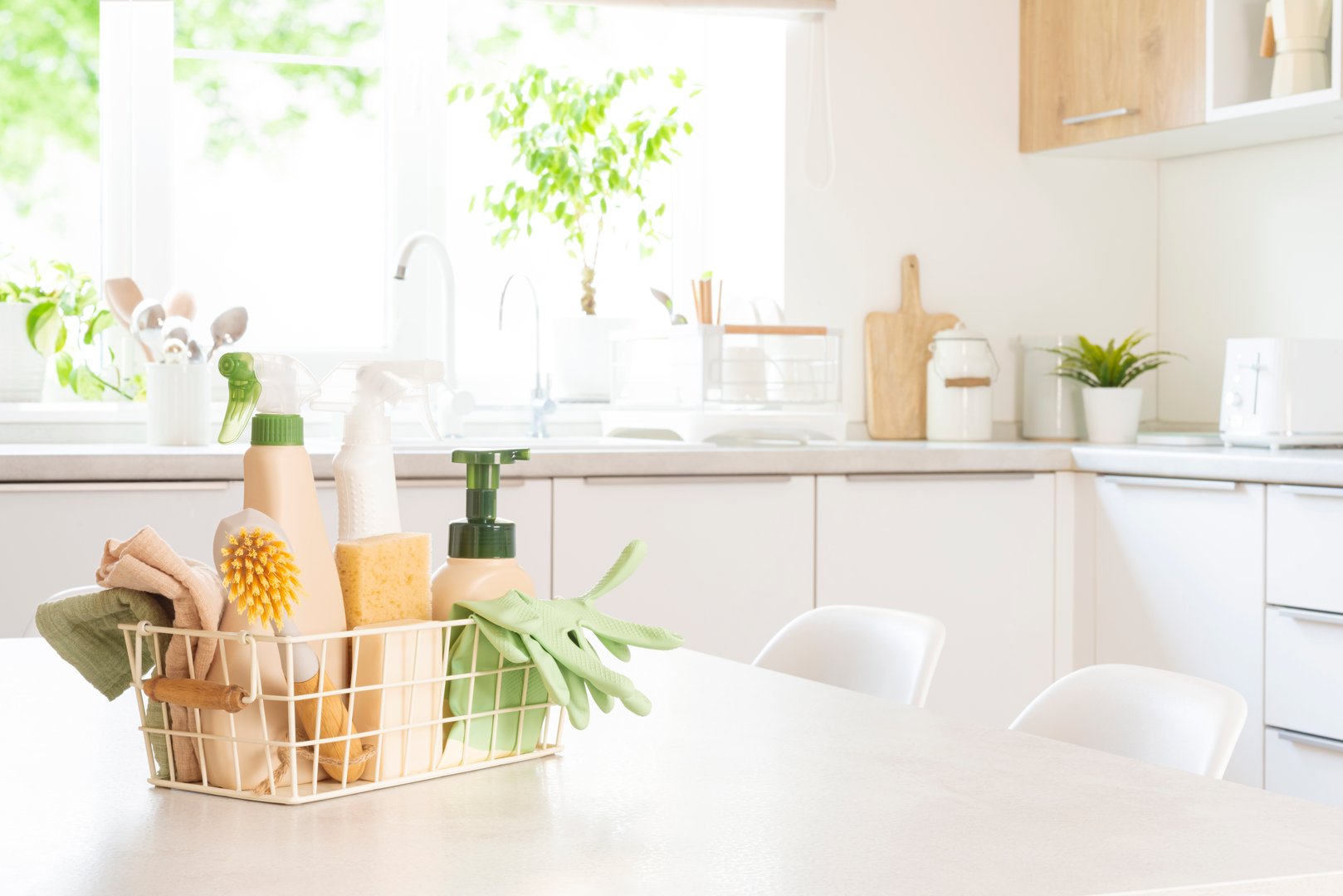 Various eco cleaning products in basket on table.
