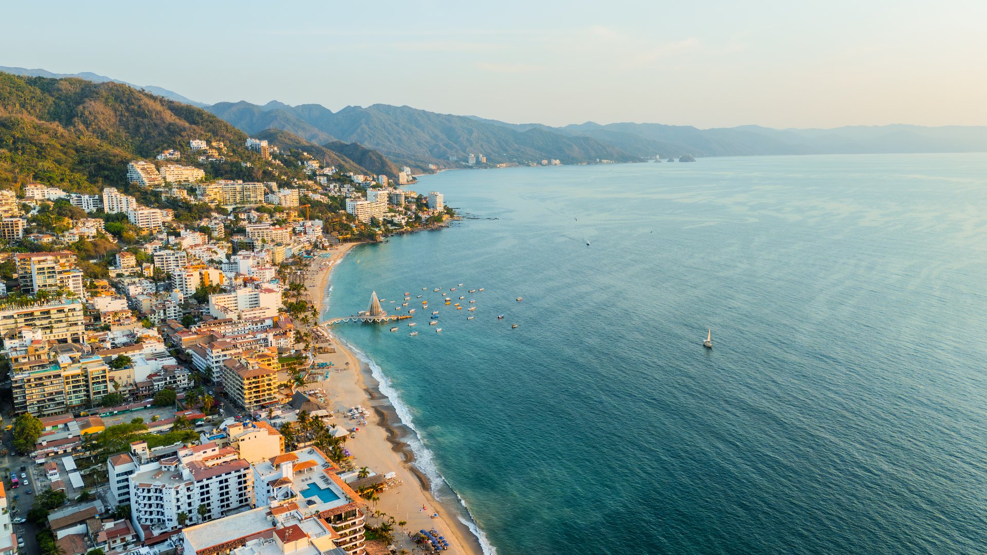 Drone view of the iconic tourist area in Puerto Vallarta with its pier standing out over the sea